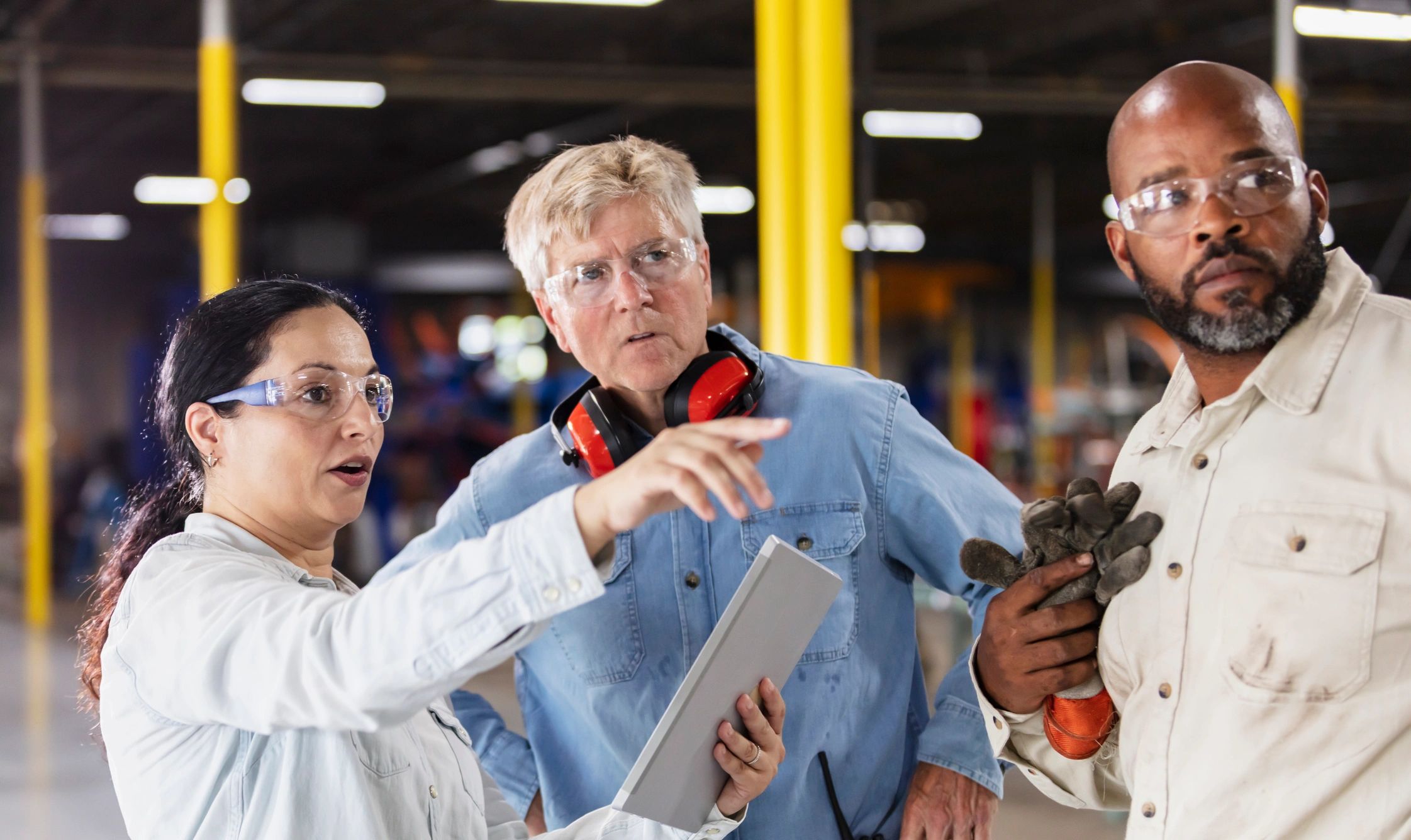 Industrial team meeting on a factory floor